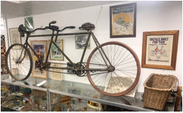 Description: A bicycle parked on the side of the room  Description automatically generated