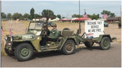 Description: A truck driving down a dirt road  Description automatically generated